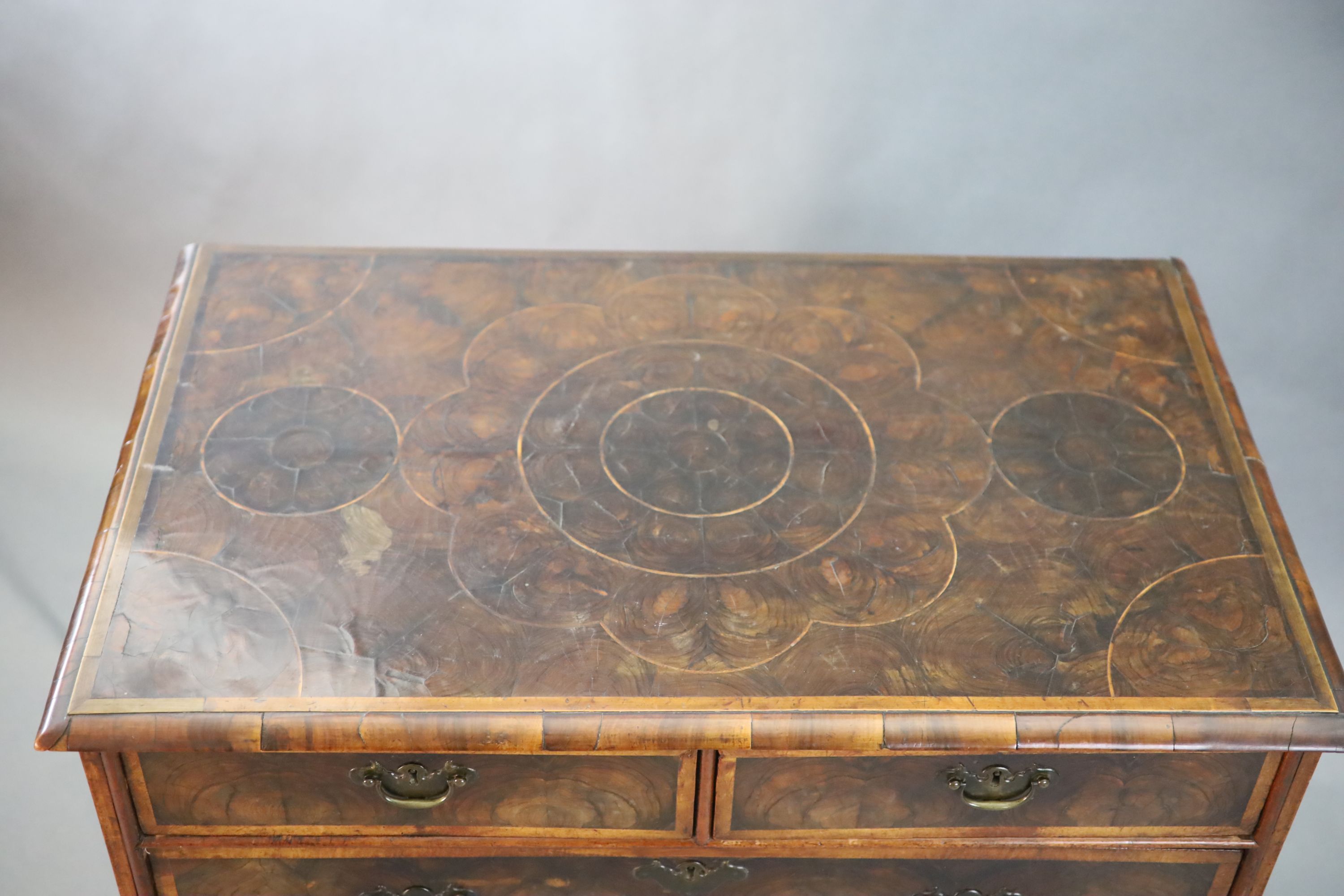 An early 18th century oyster veneered chest, W.3ft .5in. D.1ft 10in. H.3ft 1in.